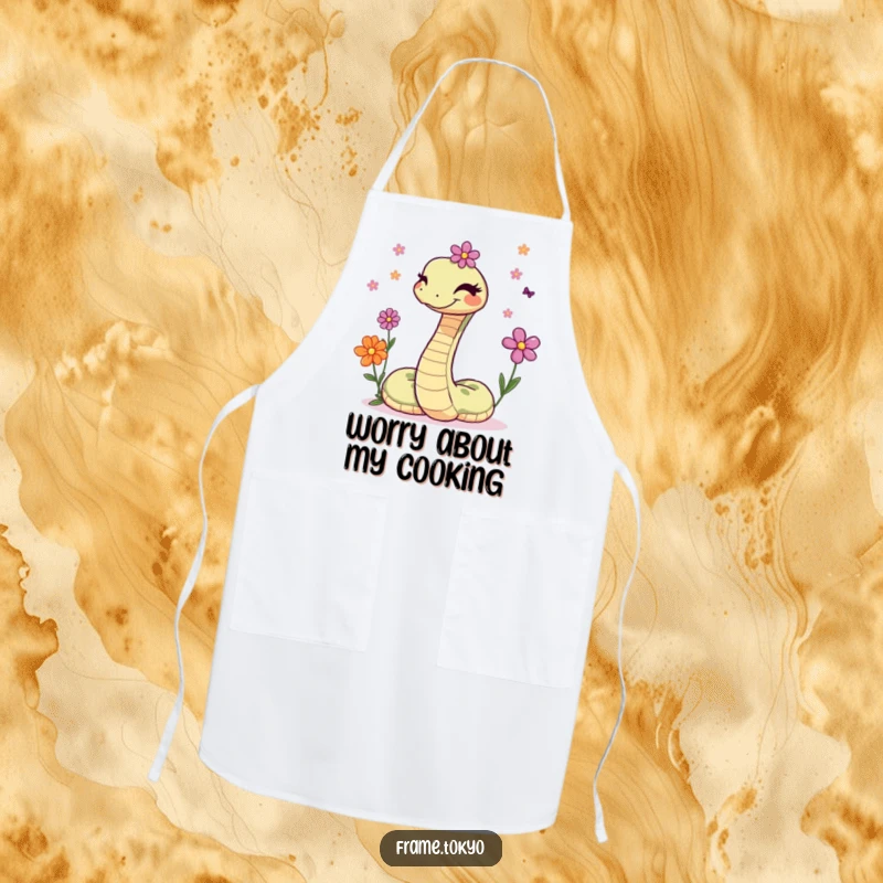 Funny apron showcasing a winking snake skillfully juggling a delightful bunch of small, colorful flowers while cooking.