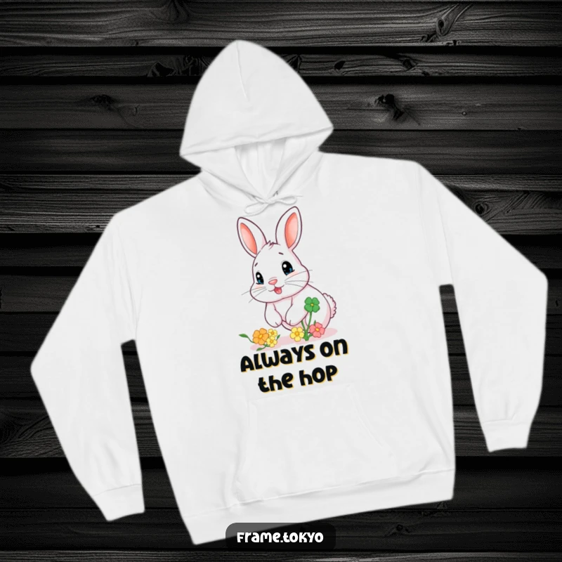 Funny hoodie featuring a rabbit with a twitchy nose, excitedly chasing a large, bouncing clover, perfect for cozying up.