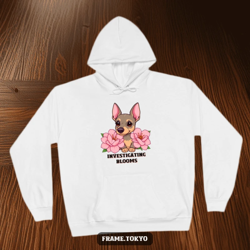 Funny pinscher hoodie featuring a dog with a curious head tilt, sniffing giant, sweet-smelling flowers with gentle intrigue.