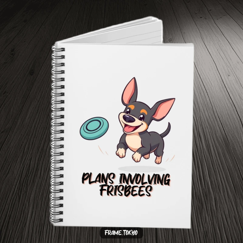 Funny pinscher notebook featuring a dog with a goofy grin playfully chasing a bouncing mini frisbee, ideal for jotting down fun ideas.