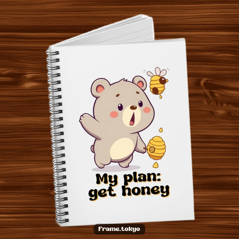 Funny bear notebook showing a surprised bear comically chasing a dripping beehive, ideal for jotting down sweet ideas.