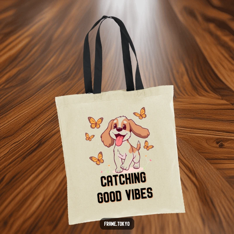 Funny Spaniel Tote Bag depicting a spaniel with its tongue lolling out in pure delight while chasing colorful butterflies.